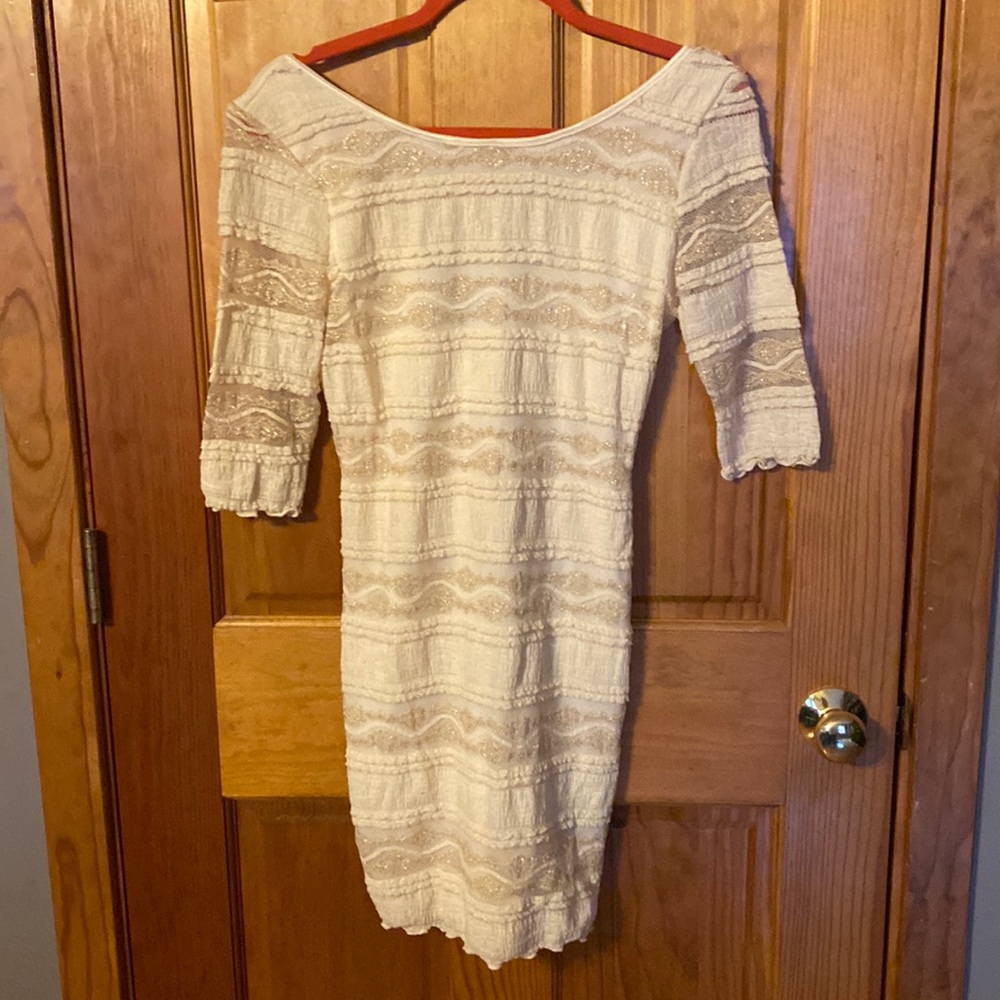 EUC/ BEBE beautiful fully lined off white with gold stitching dress.